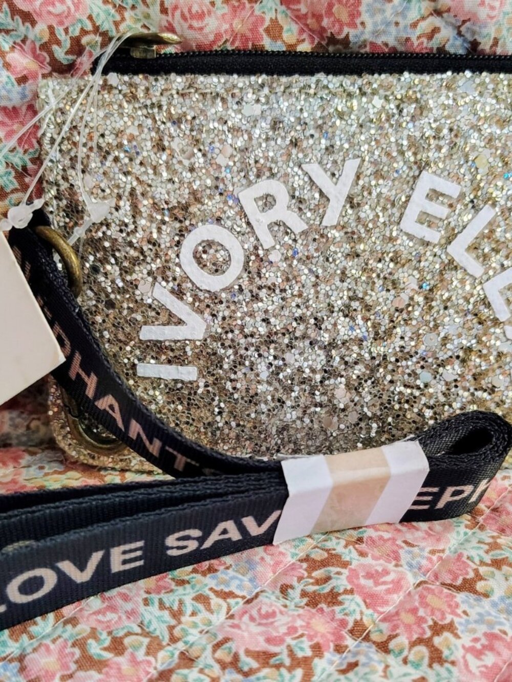 NWT Ivory Ella gold glitter pouch with a black elephant strap